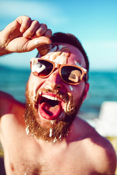 istock Crazy Male Smudging Ice Cream All Over His Head 1147350610
