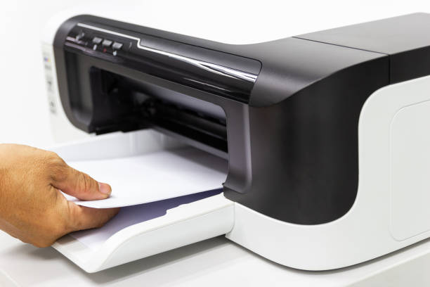 istock hand man lay down the paper from printer in the office, Business concept 1147350621