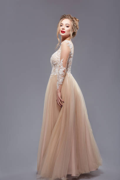 istock pretty lady with red lips in elegant evening dress 1147351552