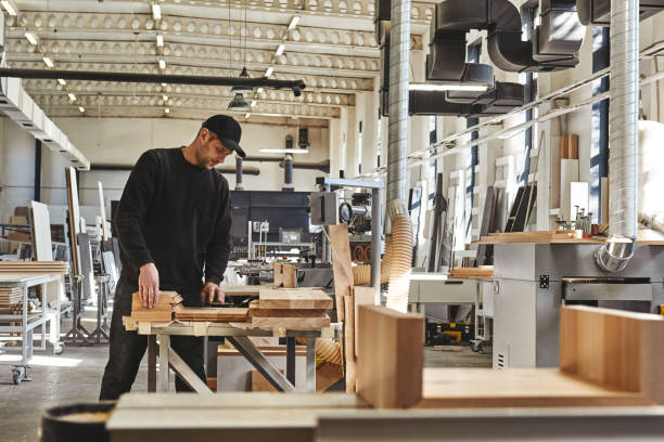 istock 100% Quality. Craftsman work at his workstation 1147351580
