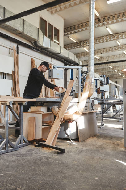 istock A Company Of Quality. Craftsman work at his workstation 1147351582