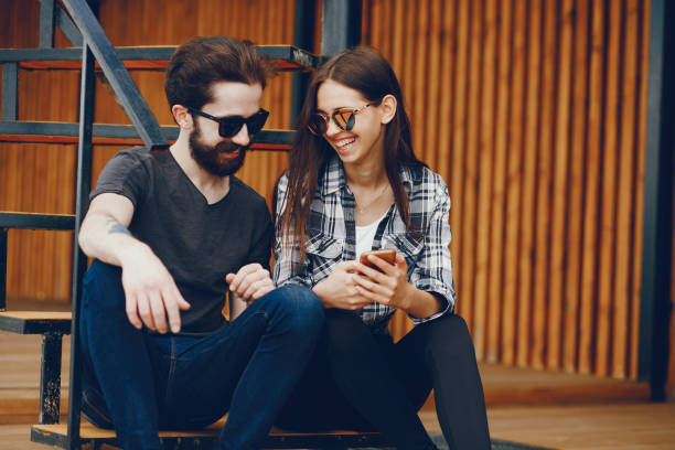 istock Couple sitting with phone 1147353224