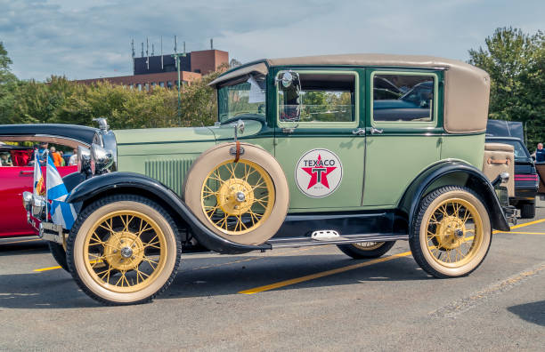 A car enthusiast has parked his Model A Ford in the perfect spot for a retro image with the fall colors of the Cottonwood trees on display in the Riverfront Park of Billings Montana