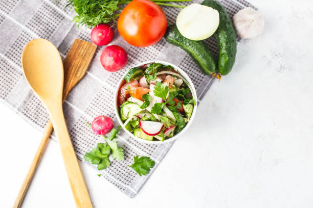 istock vegetarian vegetable salad Dietary dish on a bright table. 1147359669