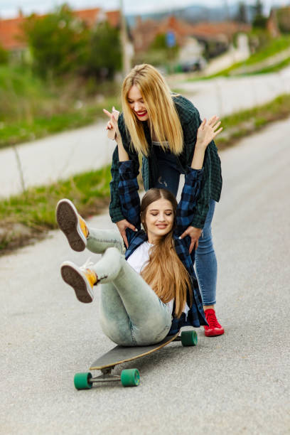 istock Women Learning to use a Skateboard 1147362306