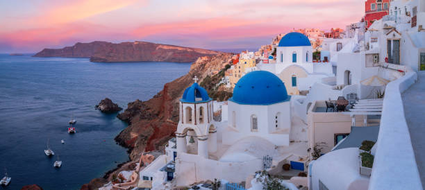 istock The famous three blue domes in Santorini at sunset 1147365171