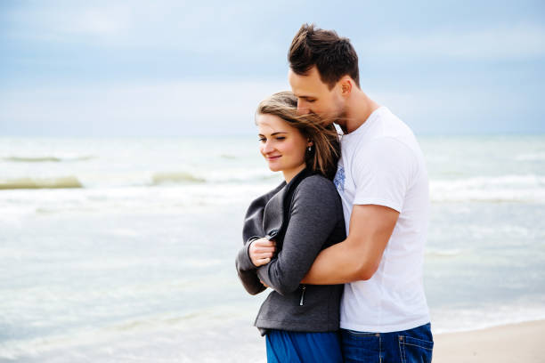 istock Young loving couple at the beach. 1147366434