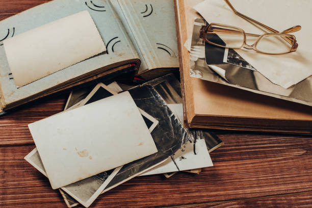 istock Stack old photos on table. Mock-up blank paper. Postcard rumpled and dirty vintage. Retro card 1147366487