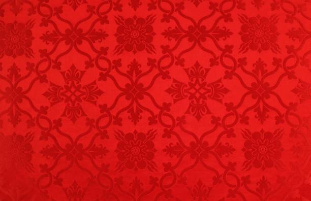 Red patterned fabric background Close-up detail of red church parament used for Pentecost Sunday pentecost religious celebration photos stock pictures, royalty-free photos & images