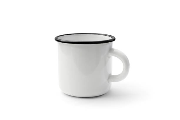 istock White enamel mug isolated on white background. For your mock-up and branding 1147367634