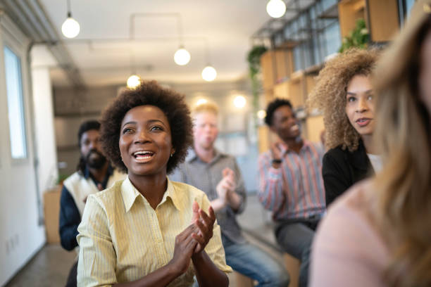 istock Audience Applauding a Great Speaker at Business convention and Presentation 1147369607