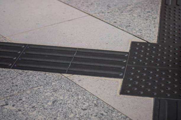 istock Tactile paving for blind handicap on tiles pathway, walkway for blindness people with train station platform. 1147372458