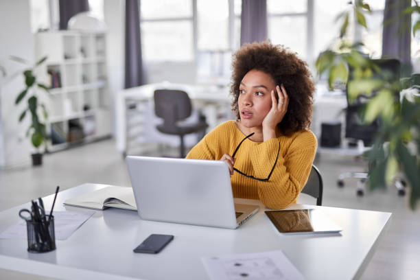 istock Businesswoman sitting in modern office and thinking. 1147375027