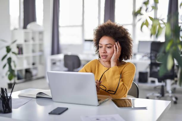 istock Businesswoman sitting in modern office and thinking. 1147375054