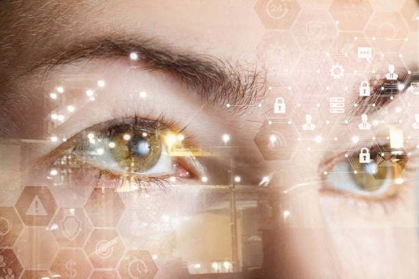 istock Human female eyes behind a comb cyber security system. 1147379716