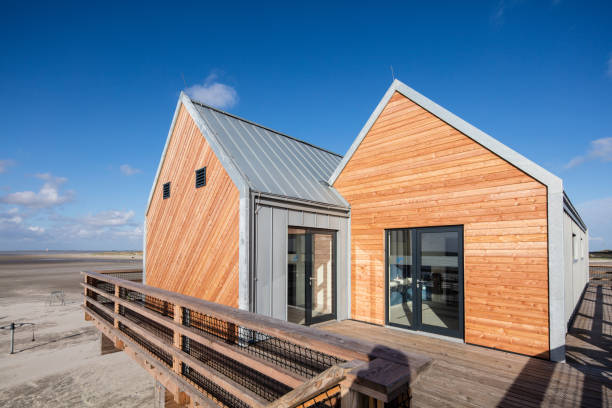 The stunning beach of St. Peter-Ording. This beach is located at the west coast of Schleswig-Holstein and is said to be the widest beach in Europe. In front a huge pile dwelling with restrooms and life rescue service. 50 Mpx image taken with Canon EOS 5Ds and Tilt-Shift 17mm.