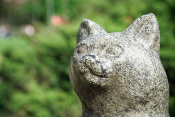 istock Cat statue from stone. Lucky rock cat head 1147381555