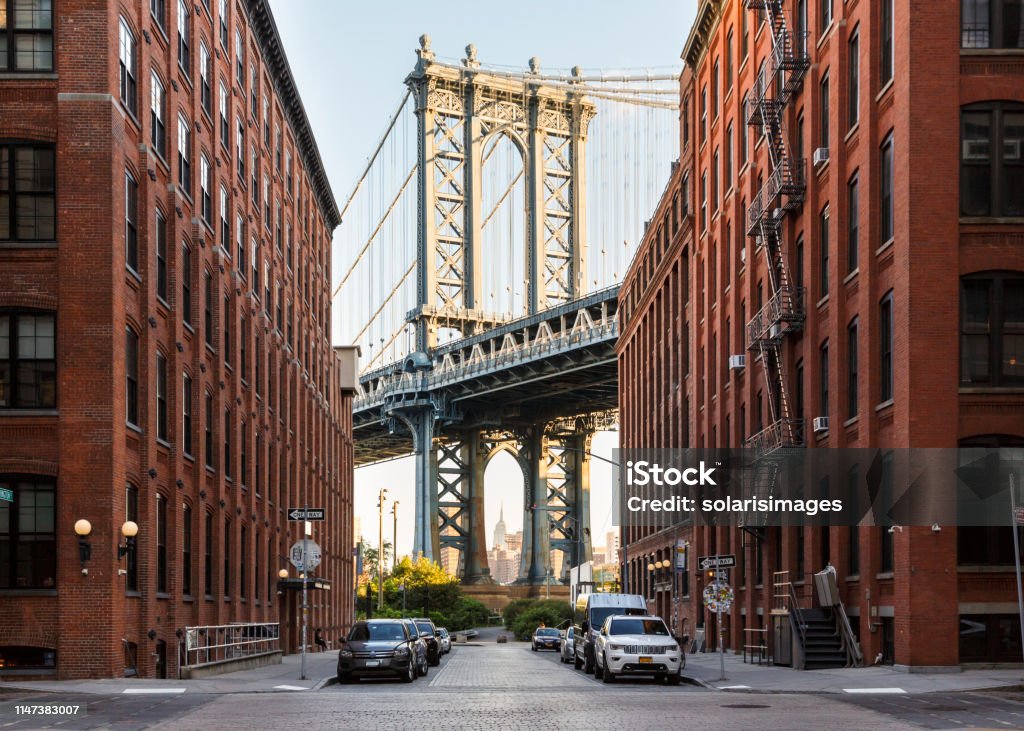 Brooklyn, NY DUMBO neighborhood street scene with Manhattan Bridge and Empire State Builiding New York City Stock Photo