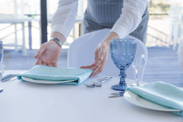 istock Restaurant waiter serves a table for a wedding celebration 1147384518
