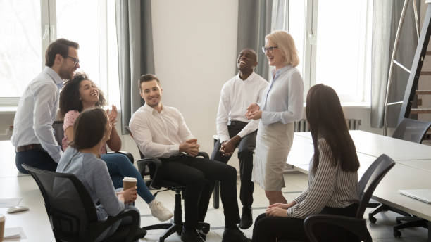 diverse corporate team having coffee break at coworking room - meeting community manager business imagens e fotografias de stock