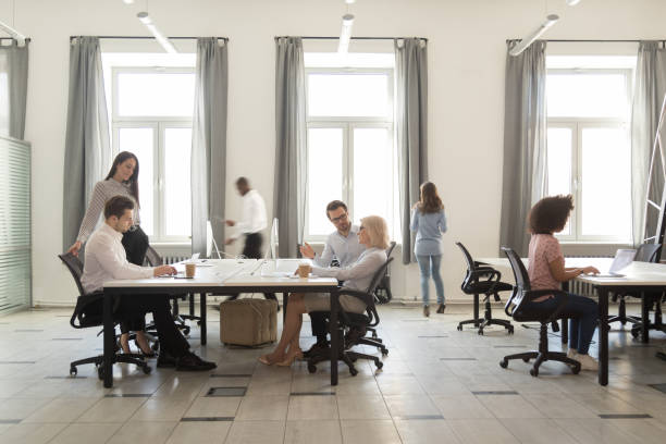 istock Busy diverse employees working in modern office coworking room 1147384824