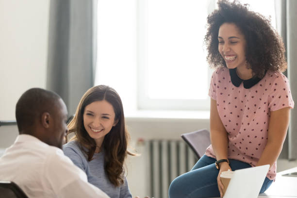 istock Diverse employees take break during working day laughing feels relaxed 1147384826