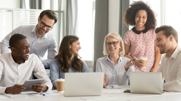 istock Cheerful multiracial office workers having fun at break in workplace 1147384855