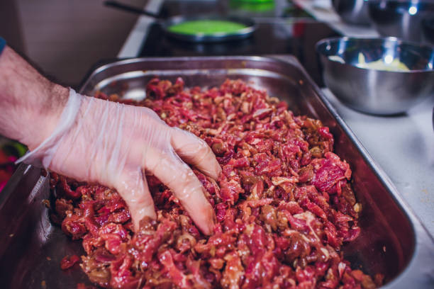 istock beef raw cheese sliced hand cooks 1147384985