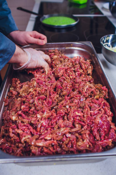 istock beef raw cheese sliced hand cooks 1147384987