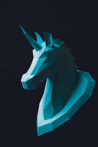 istock Unicorn turquoise head paper isolated on black background. Copy space. 1147385033