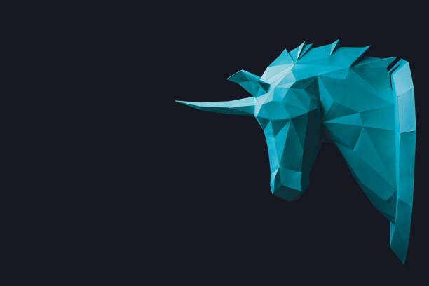 Unicorn turquoise head paper isolated on black background. Copy space. stock photo