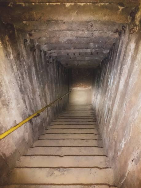 istock descent tunnel in the old catacombs 1147386220