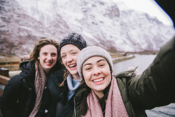 Friends Take Selfie in Norway's Fjords stock photo