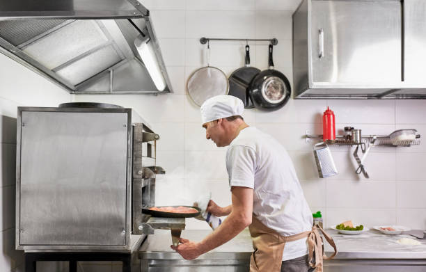 istock Making pizza at an Italian restaurant 1147390483