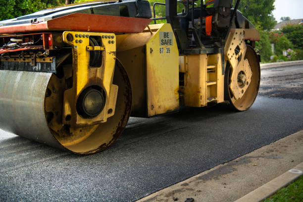 istock Large Steamroller Smoothing New Asphalt Down on Street 1147390511