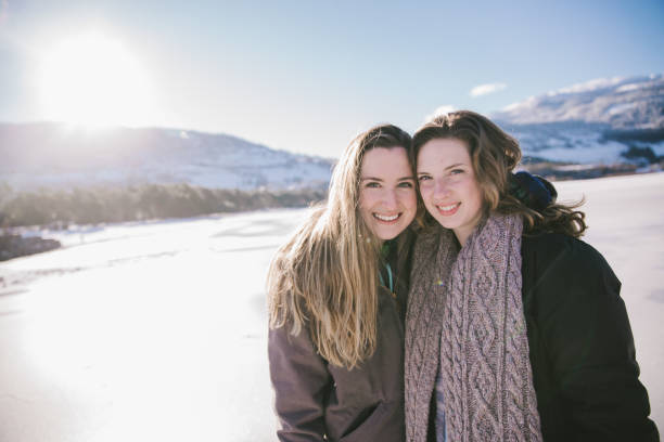 istock Two Friends Smiling and Laughing in the Snow 1147390621