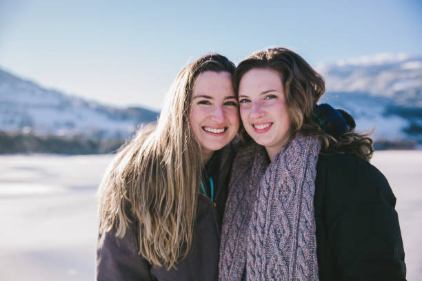 istock Two Friends Smiling and Laughing in the Snow 1147391189
