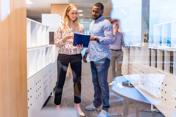 istock Business people having a conversation at the office 1147392163