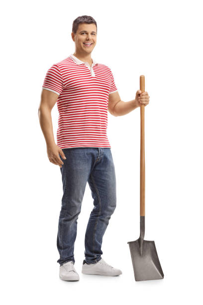 istock Young handsome posing man with a shovel 1147393336