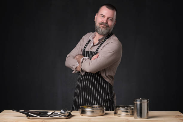 istock Bearded male chef showing different spices he uses. 1147394890