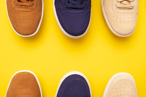 istock Three pair of sneakers on colored background 1147395778