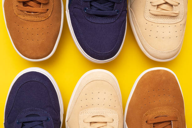 istock Three pair of sneakers on colored background 1147395848