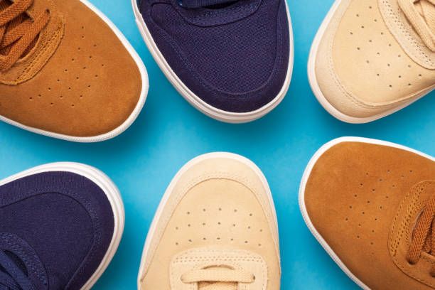 istock Three pair of sneakers on colored background 1147395936