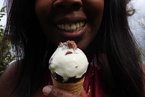 African ethnic woman enjoys icy deserts