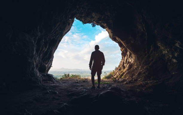 istock Walking out of the cave 1147397429