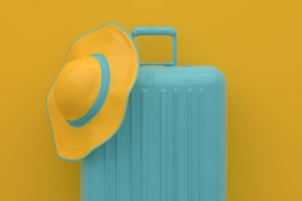 istock Summer, Travel Minimal Concept, Hat and Suitcase on Yellow Background 1147398624