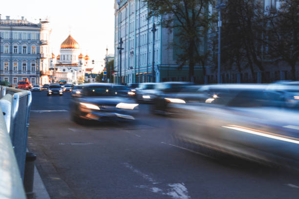 Vehicles halted at a signal while waiting, illustrating urban commuting and transportation.