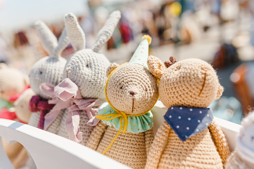 small knitted baby toys for sale at outdoor handmade market