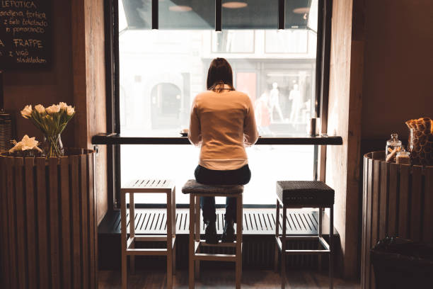 istock A girl sitting alone and typing a business e-mail 1147403167