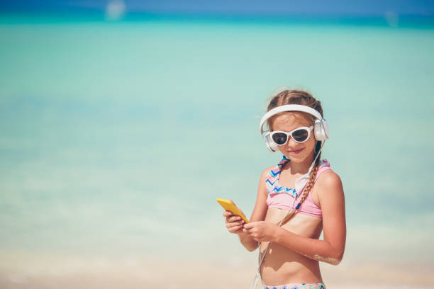 istock Adorable active little girl at beach during summer vacation 1147406567